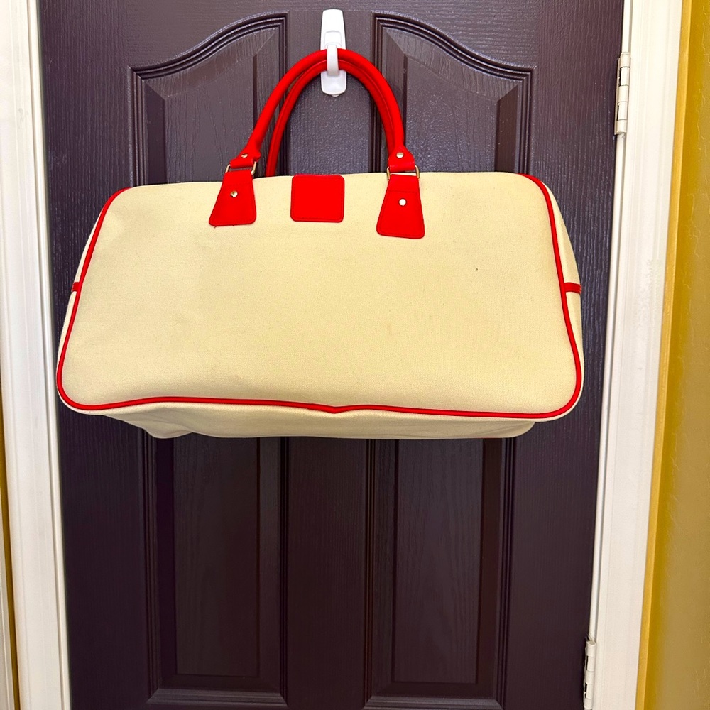 Chi tote bag cream with red trim zippered top inner pocket & inner zipper pocket